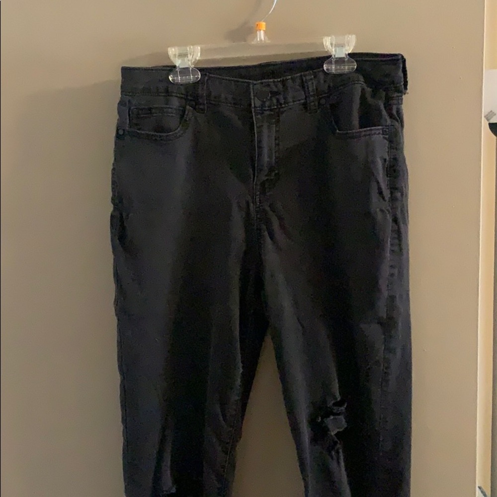 Distressed black skinny jeans